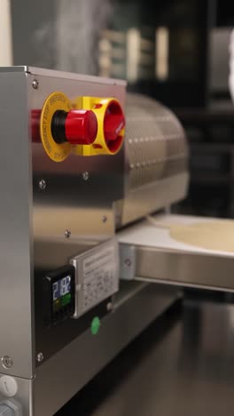 commercial dough processing machine in action