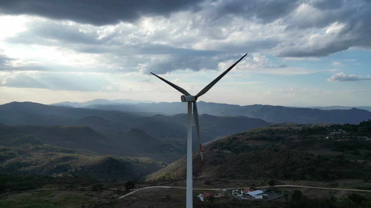 Wind Turbine Over Scenic Mountain Range in Honduras, Renewable Energy