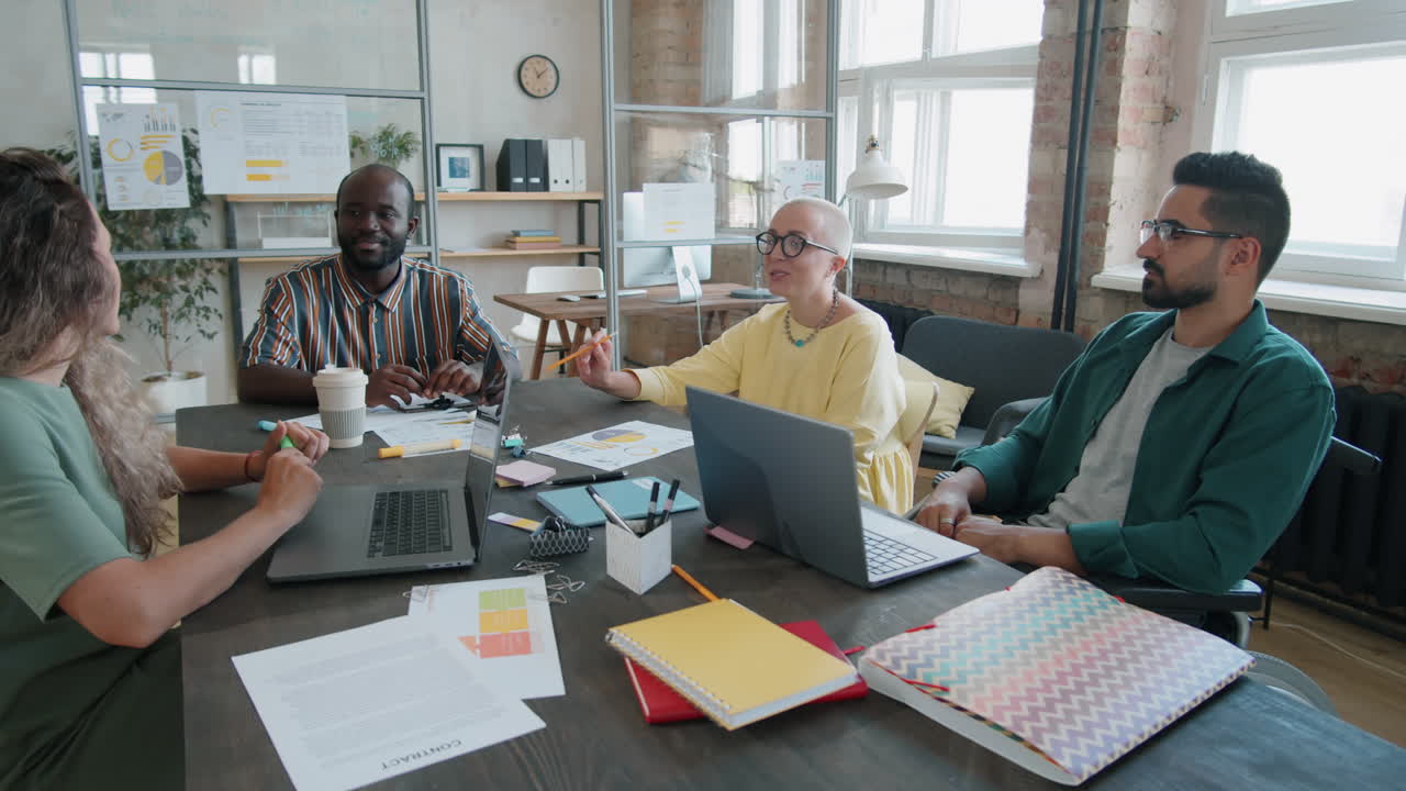 Group of Diverse Coworkers Talking at Business Meeting