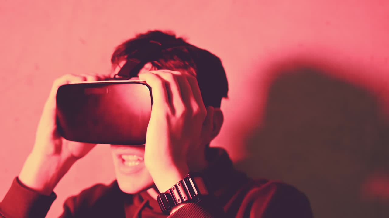 Young man amazed while wearing a virtual reality head set