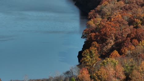 colorful autumn forest and lake in lake fort smith state park, arkansas, united states - aerial shot