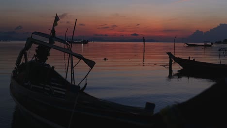 Fishing-boat-lying-on-ocean-shore-inclined-in-water