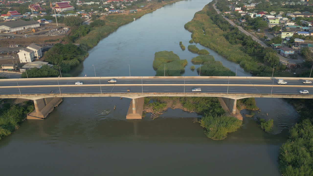 Commuters Head Home Over The Ping River In Nakhon Sawan Thailand Sunset 4K 60FPS