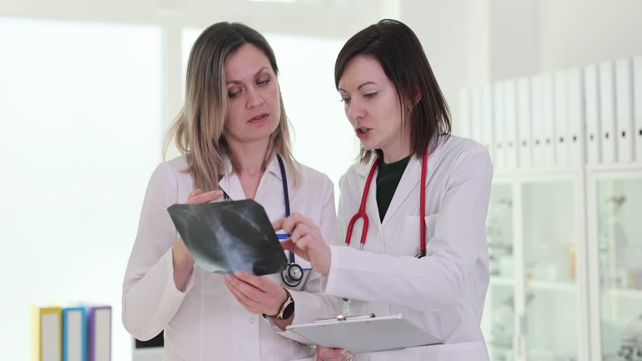 Two doctors examining an x-ray