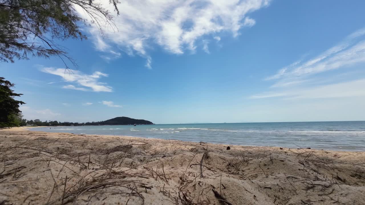 Time-lapse sequence at Lamai Beach, Koh Samui, Thailand, capturing the sandy coastline, turquoise ocean, and fast-moving clouds in a tropical seascape