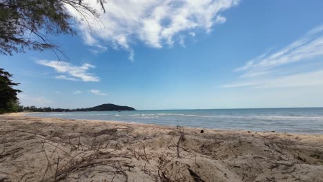 time-lapse sequence at lamai beach, koh samui, thailand, capturing the sandy coastline, turquoise ocean, and fast-moving clouds in a tropical seascape