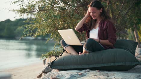 young caucasian woman freelancer using her laptop