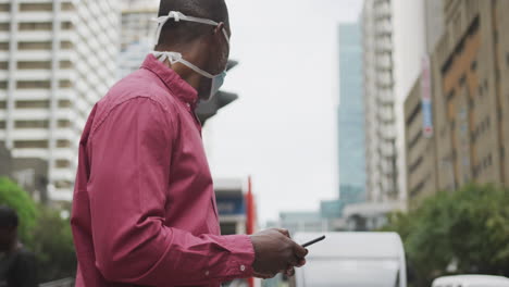 african american man on the go wearing coronavirus covid19 mask