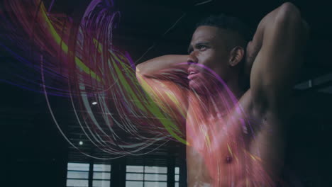 animation of colorful abstract lines swirling around man stretching in school gym