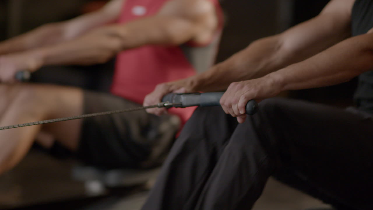 People exercising on rowing machines