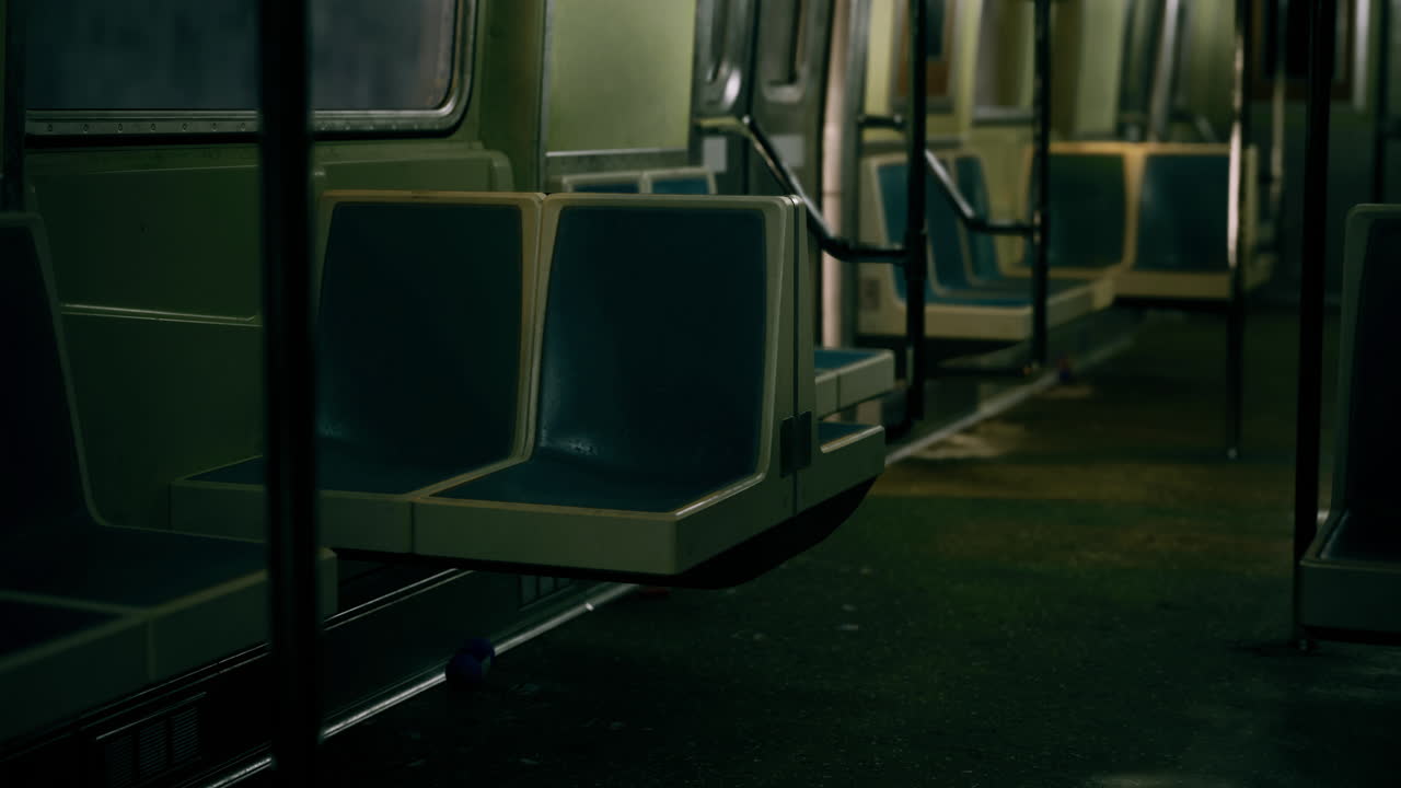 Empty subway train interior showcasing modern seating and lighting