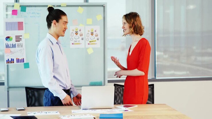 Business colleagues interacting with each other