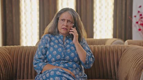 angry indian mother talking on phone call