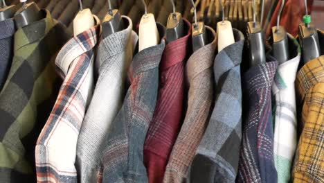 assortment of plaid flannel shirts on display