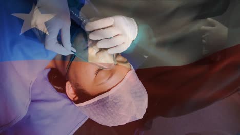 animation of flag of chile waving over surgeons in operating theatre