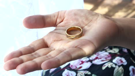 woman holding a ring