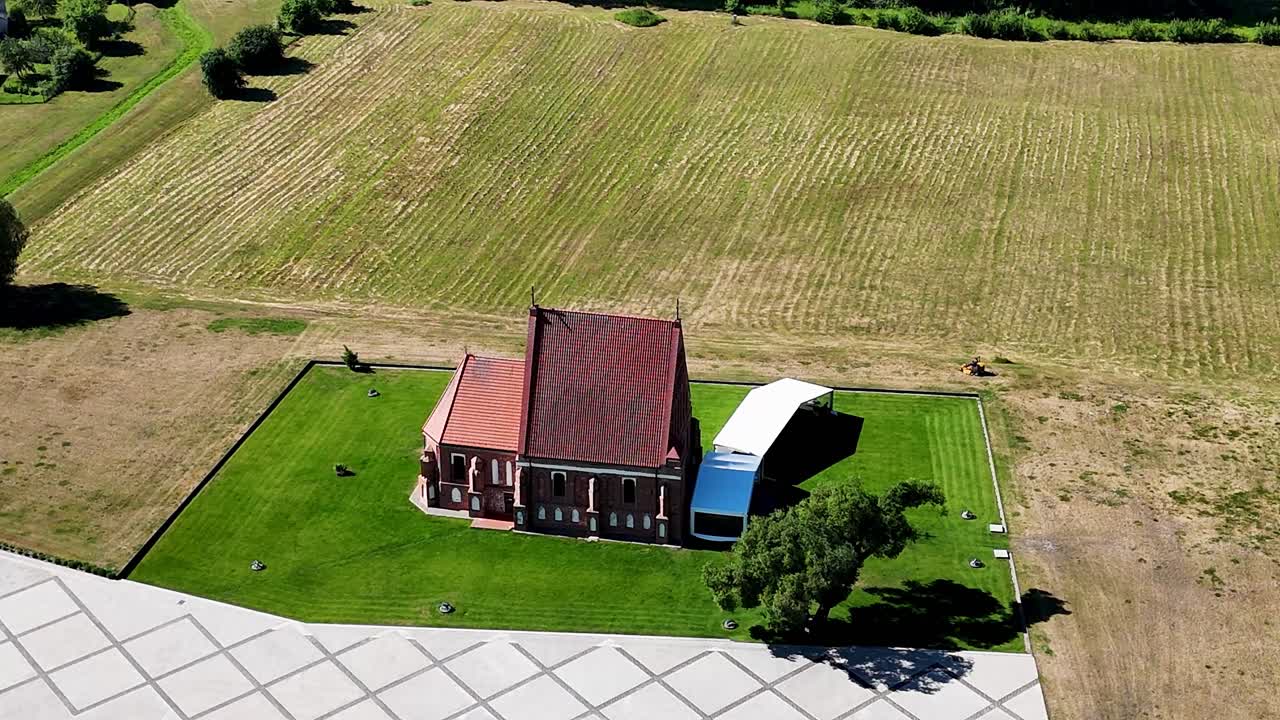 Old St Johns Baptist church in Lithuania, aerial orbit view
