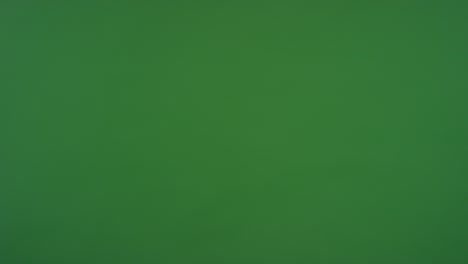cu man and woman in suits shaking hands on green screen