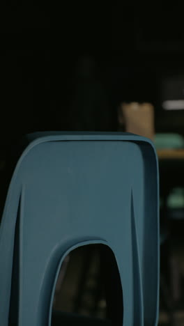 close-up of a blue plastic chair