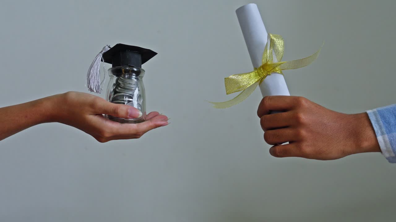 Side-by-side presentation of graduation certificate and educational fund jar
