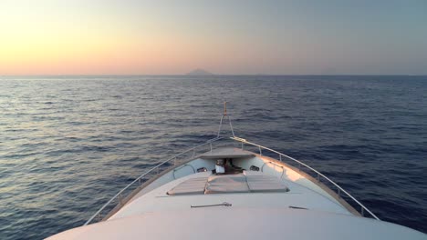sailing at the sunset through the ocean