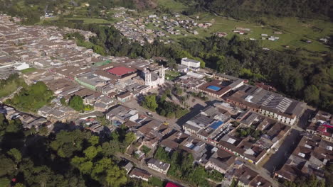 Aerial-Drone-orbiting-around-the-main-square-in-Silvia,-Colombia