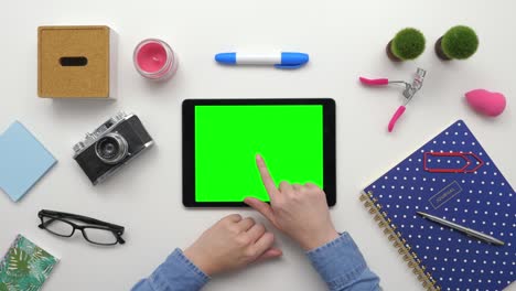 top view overhead of woman using digital tablet by personal accessories
