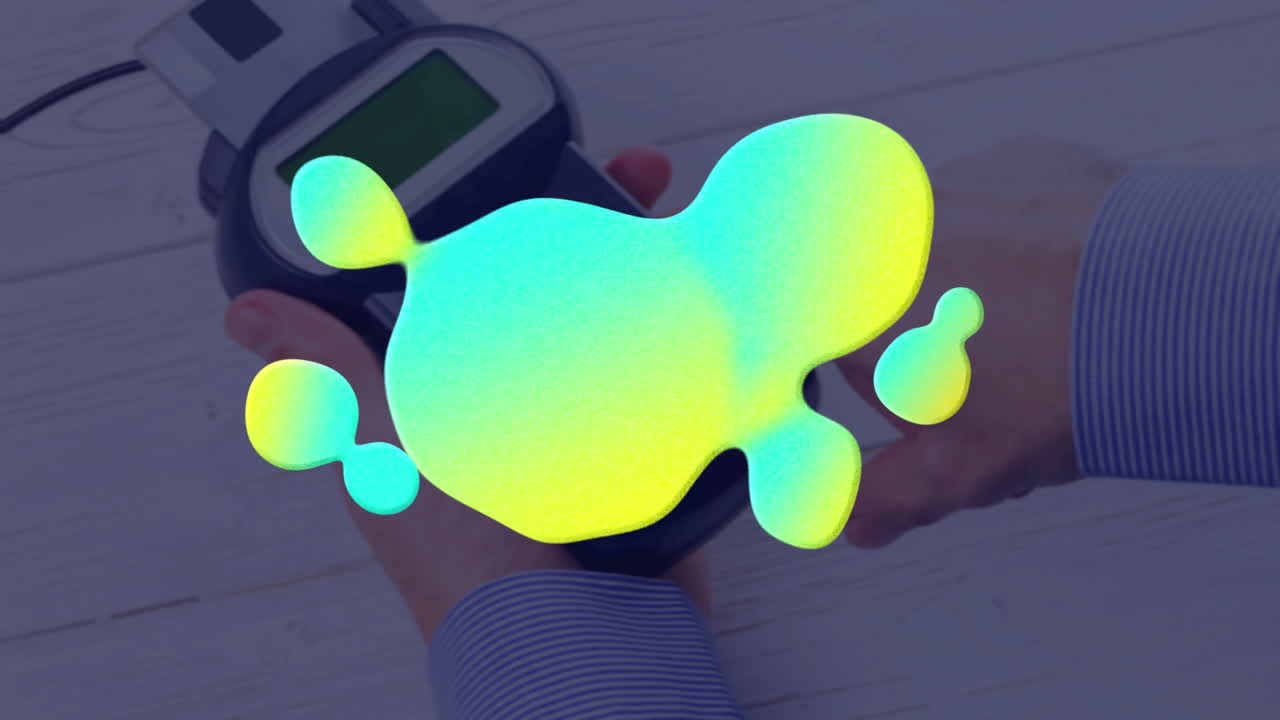 결제 터미널 위에 다채로운 얼룩의 애니메이션