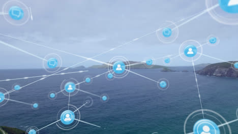 animación de una red de iconos digitales contra una vista aérea de las islas y el mar