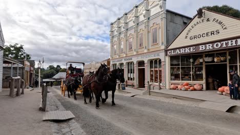 horse-drawn carriage passing through historic town street