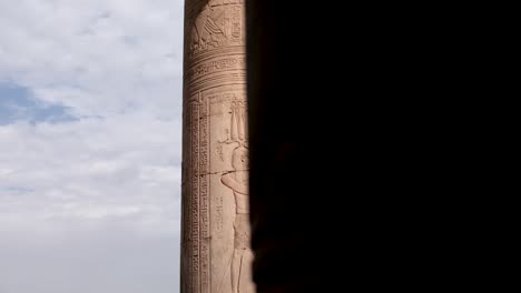 detail of ancient writings on a column in the temple of kom ombo, egypt.