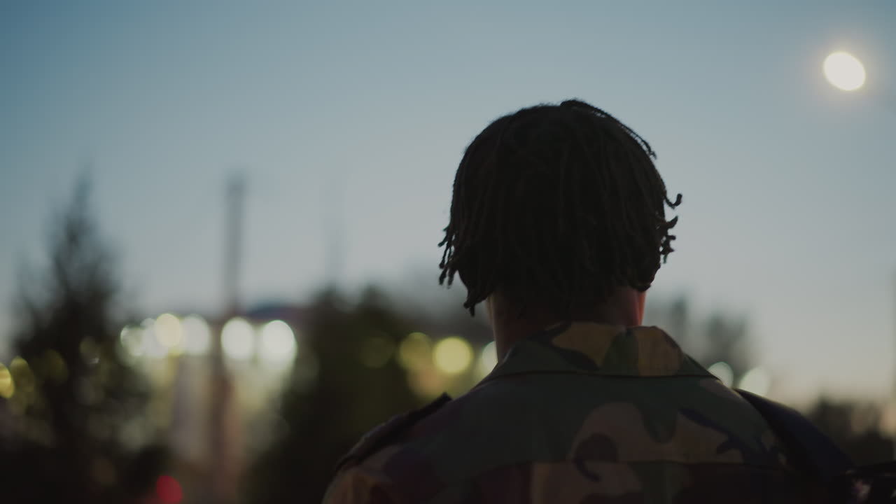 Warrior Keeps Vigil As Darkness Descends, Armed Protector Surveys Shadowy Approaching Dusk Silently, Steadfast Military Figure Silently Monitors Encroaching Darkness During Nighttime Hours