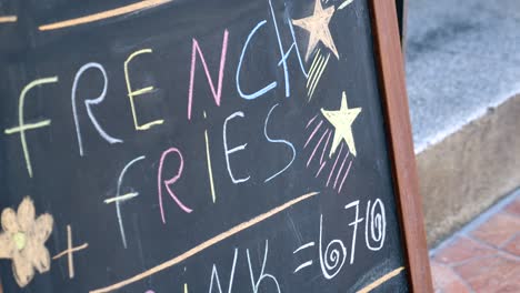 chalkboard menu with french fries special