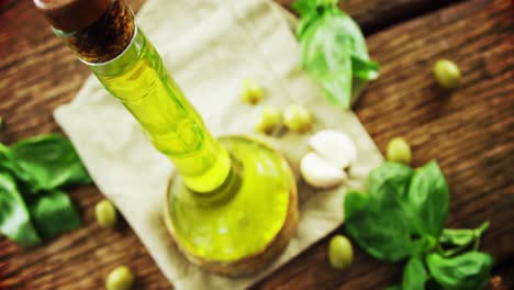 herbs and olive oil on table