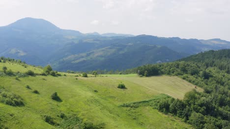 Aerial:-beautiful-Serbian-countryside-hills,-green-wild-pastures