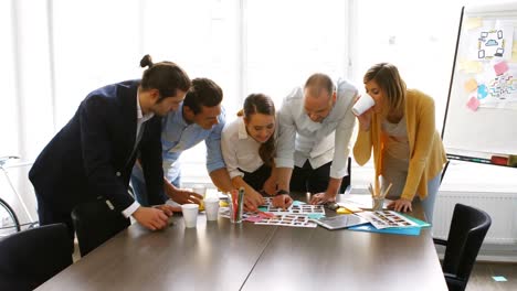 graphic designers discussing over photographs