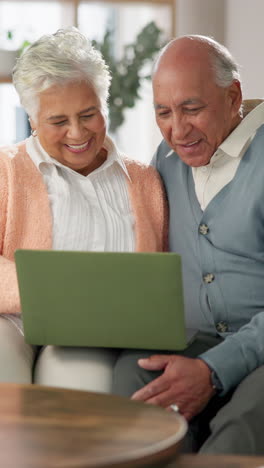 senior couple using a laptop together