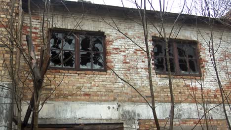 ruins of burned brick house after fire disaster accident