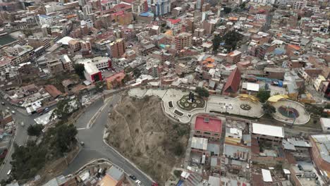 el alto in la paz, bolivia, aerial drone fly above populated town in south america, cityscape of houses and spectacular high altitude slum buildings