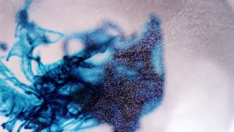 abstract liquid blue ink motion in sparkling white background texture