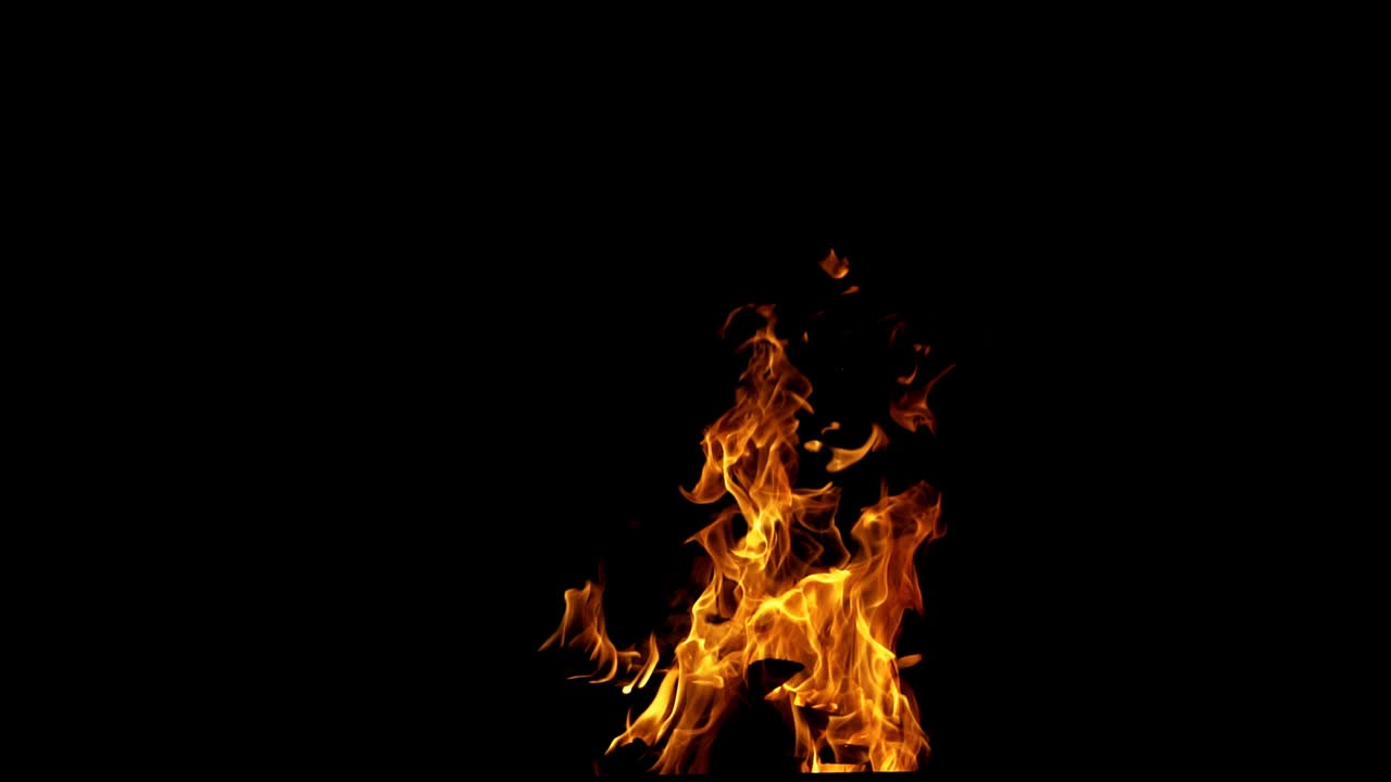 Fire flame on the black background. Fire in darkness. Slow motion