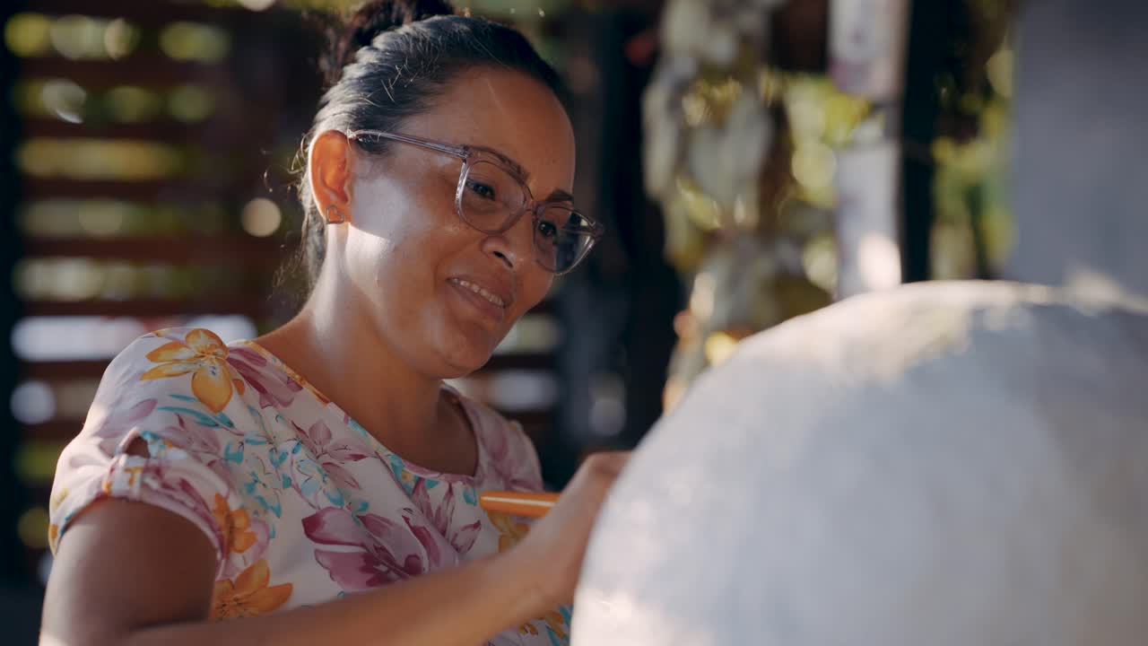 Artist Painting a Sculpture