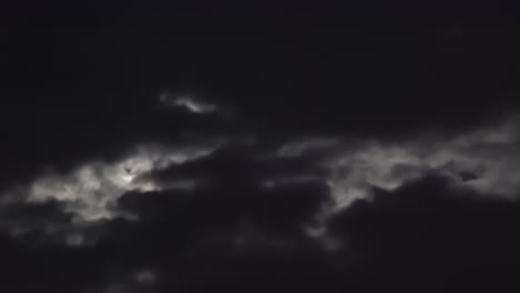 clouds flowing in the sky on a full moon