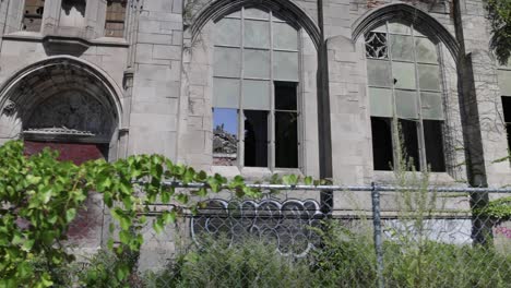 Abandoned-historic-City-Methodist-Church-in-Gary,-Indiana-with-gimbal-video-walking-sideways