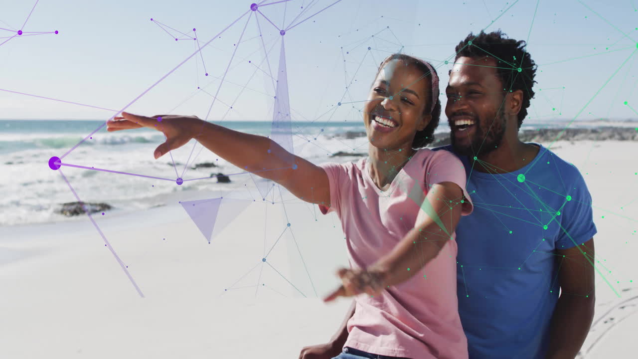At beach, couple smiling with digital network connections overlay in animation
