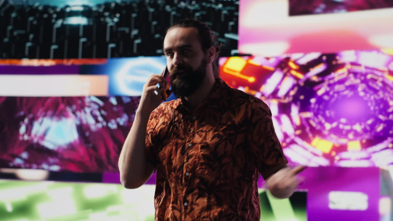 Artistic person and DJ answering phone call under vibrant neon lights