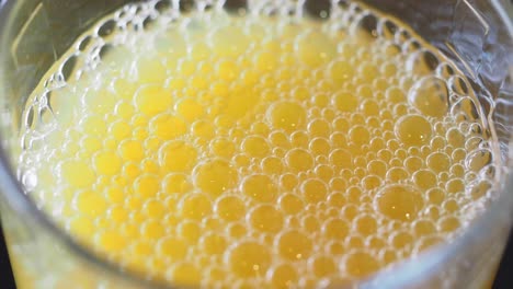 Close-up of Bubbles in Orange Juice