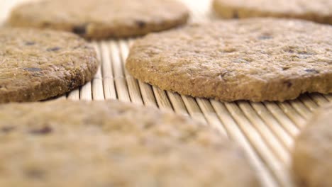 fresh homemade baked oatmeal cookies with raisins on a traditional bamboo mat