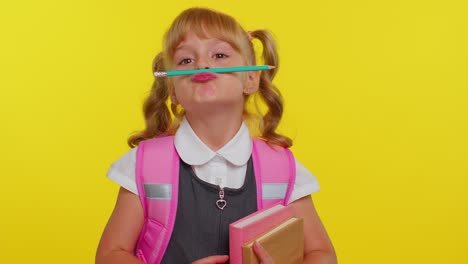 Funny-joyful-kid-primary-school-girl-making-playful-silly-facial-expressions-fooling-around-with-pen