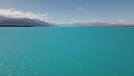 high angle view over distinctly blue glacial lake pukaki, southland, nz